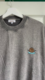 Gray sweatshirt with a coffee graphic on a hanger