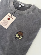 Gray sweatshirt with a small embroidered design on a white background